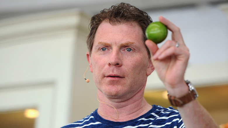 Bobby Flay holding a lime