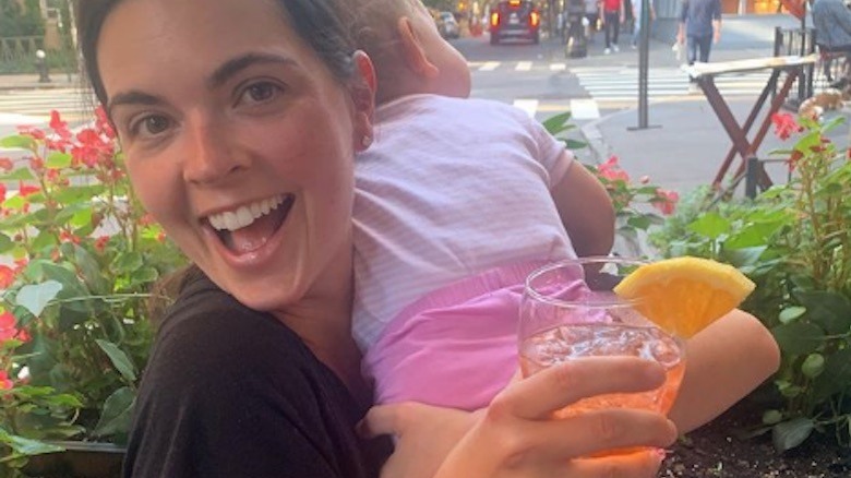 Katie Lee, baby and cocktail