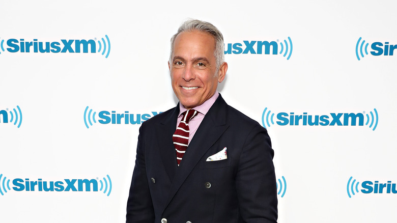 Geoffrey Zakarian in a suit on a red carpet