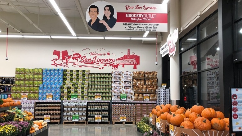 interior of San Lorenzo Grocery Outlet with locally owned and operated signage