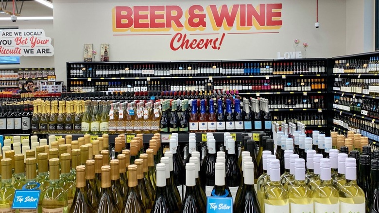 Grocery Outlet beer and wine section with shelves full of wine bottles