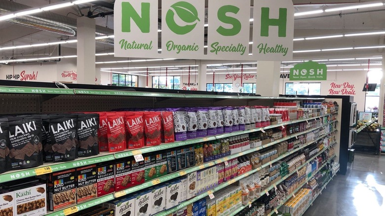 Grocery Outlet NOSH aisle displaying KIND bars and other products