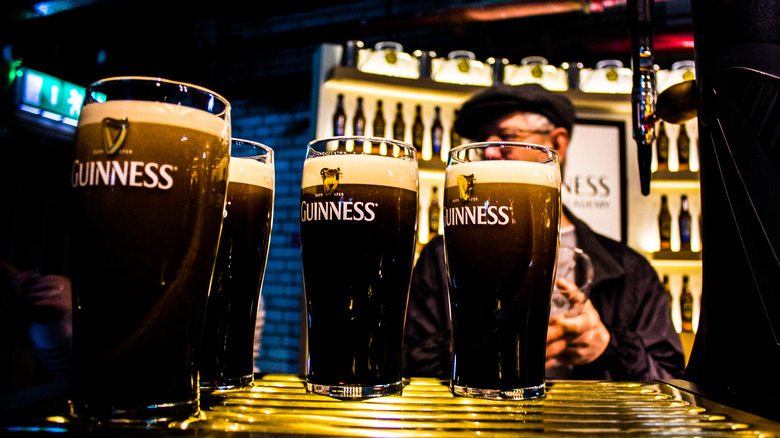 Pints of Guinness at a bar