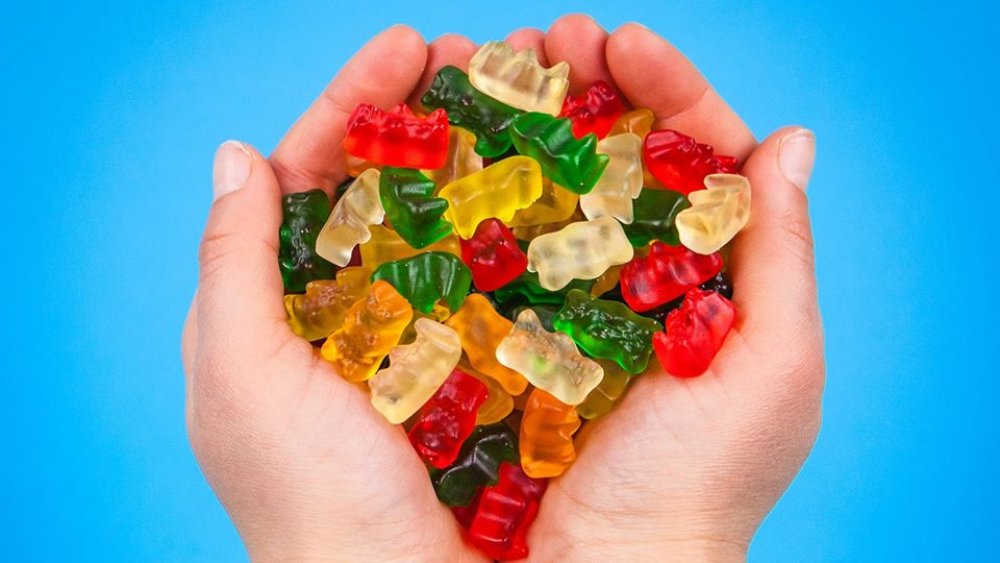 gummy bears in hand