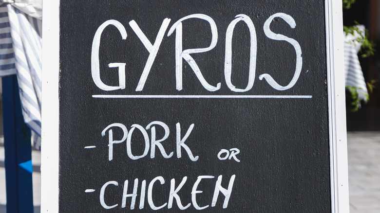 A black sign reading "Gyros" in white