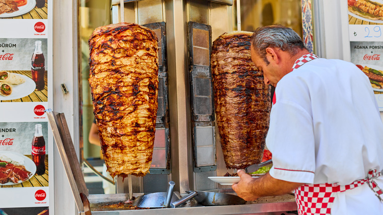 A man working in a gyro food stall