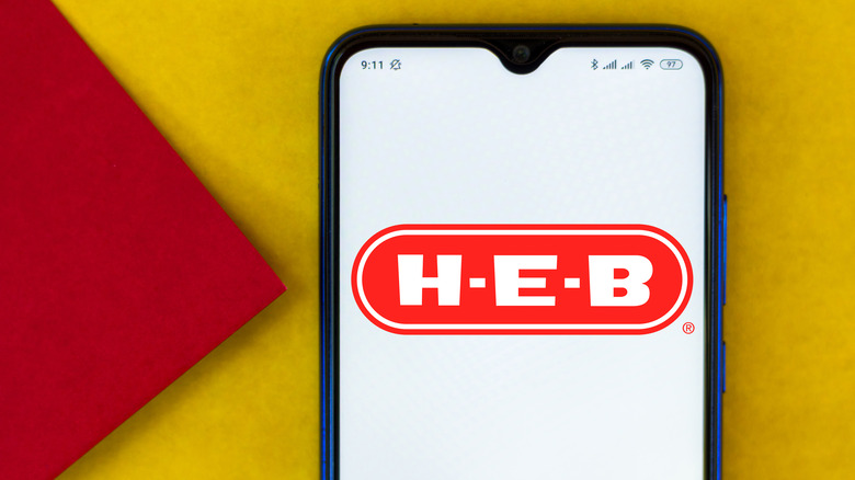 Smartphone displaying H-E-B logo