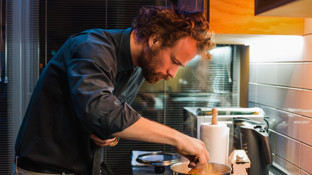 Man cooking in kitchen