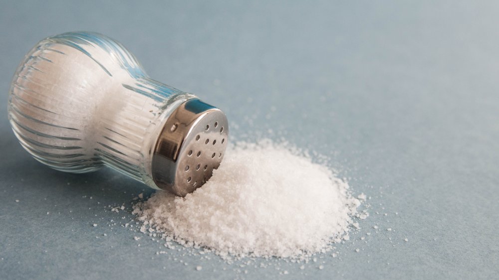 salt spilling from a saltshaker