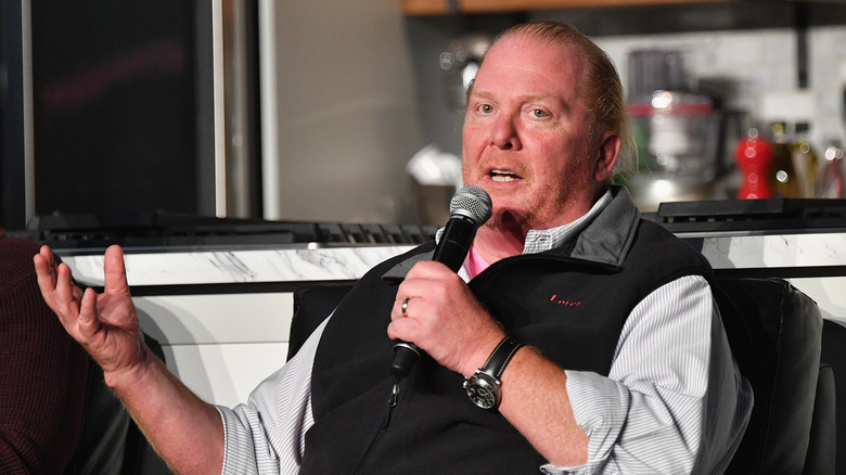 Chef Mario Batali speaks into microphone