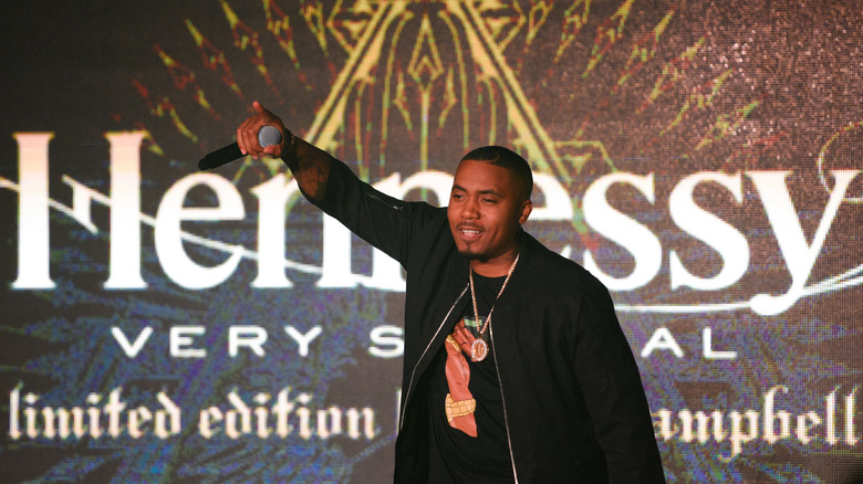 Nas pictured with a Hennessy sign