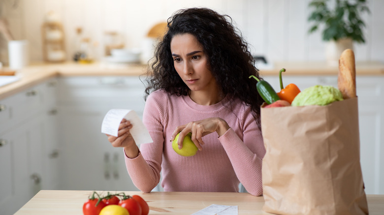 Woman checking bills