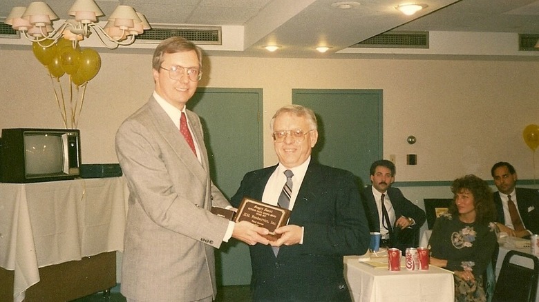 Steve Jackson presenting an award to Jim Plait