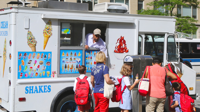 ice cream truck and line of customers