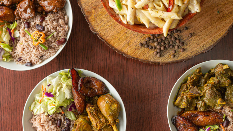 Jamaican dishes on a brown wood table