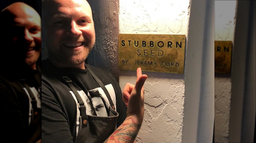 Jeremy Ford pointing at restaurant sign