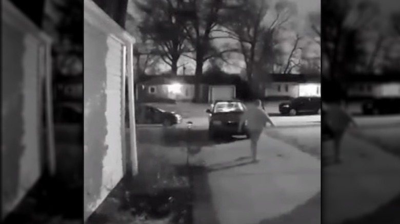 Ring doorbell capture of delivery driver throwing Jimmy John's sandwich