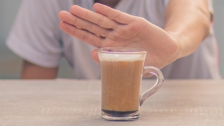Hand rejecting coffee