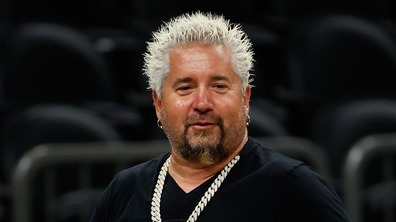 Guy Fieri in a black shirt