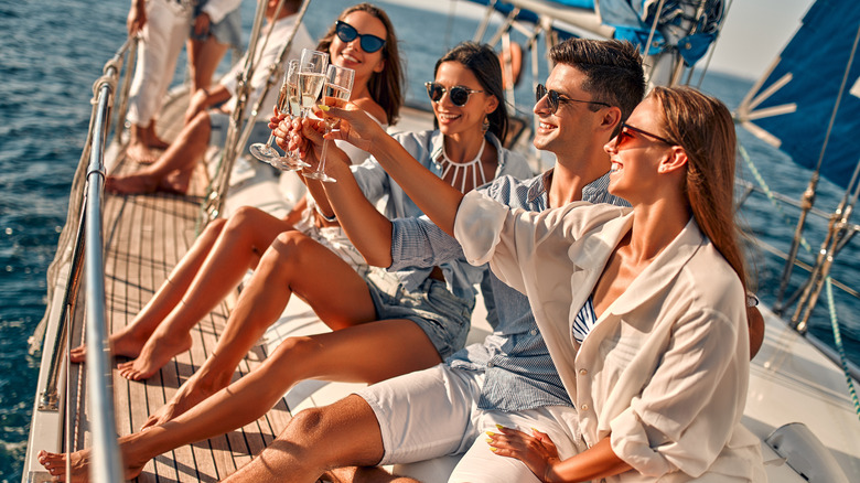 friends on yacht enjoying champagne