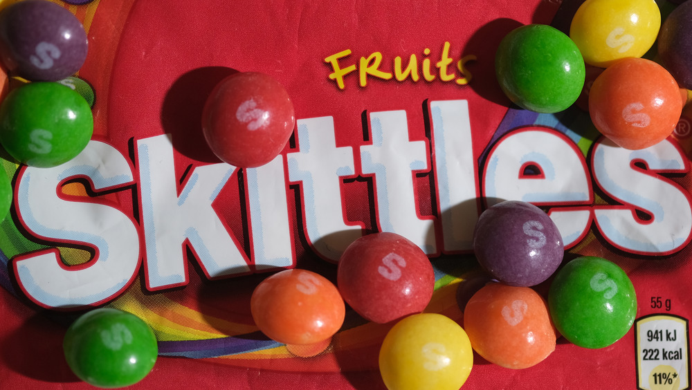 Red package and colorful Skittles