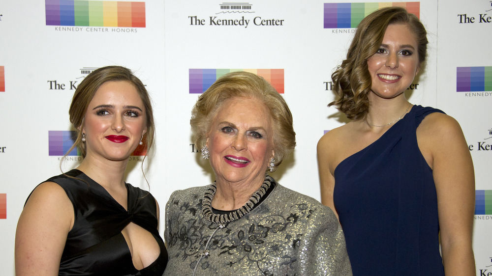 Three women against a white backdrop