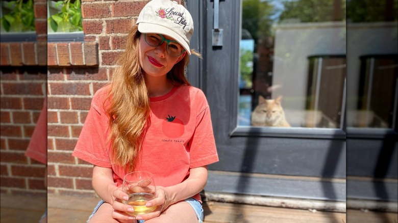 Mary Berg sitting on porch 