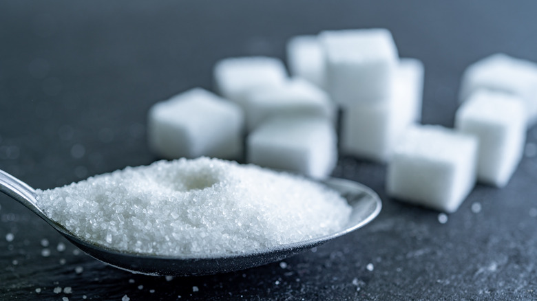 sugar cubes and sugar on spoon