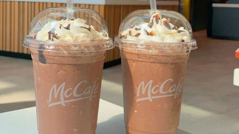 two mcdonald's frappes on table