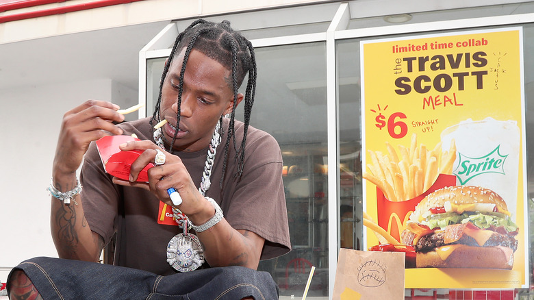 Travis Scott holding french fries