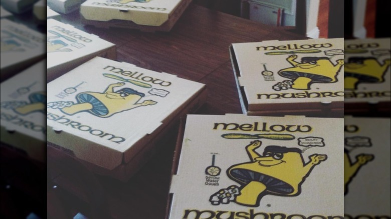 Mellow Mushroom pizza boxes on table 