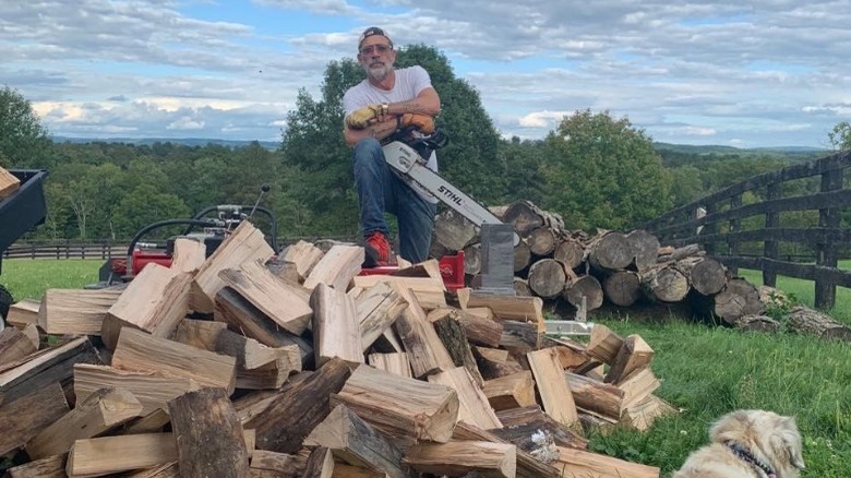 Jeffrey Morgan chopping wood on his farm