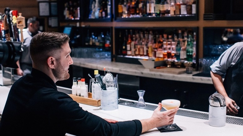 A man at bar at Michael Jordan's Steakhouse