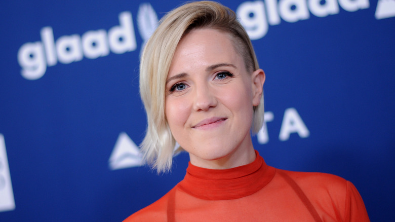 Hannah Hart wearing an orange shirt