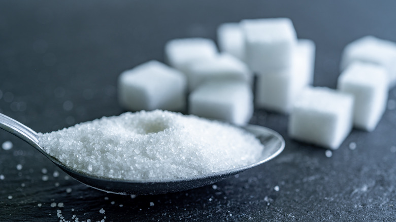 sugar cubes and sugar in a spoon