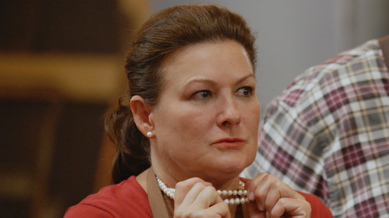 American Barbecue Showdown contestant holding pearls