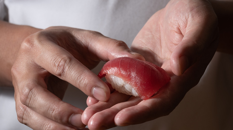 chef making nigiri