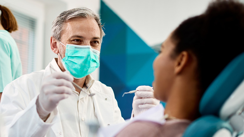 Dentist facing a patient