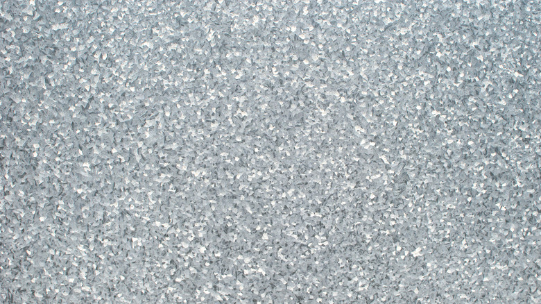 Abstract silver metal texture with particles