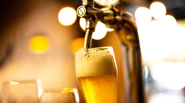 A beer glass under a tap