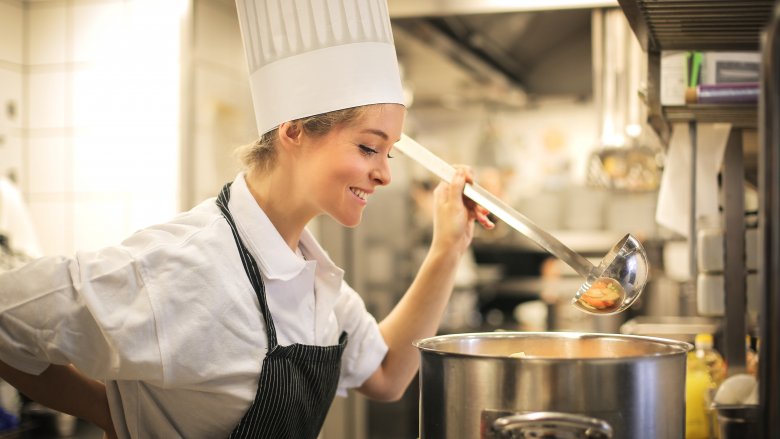 Chef overseeing cooking pot