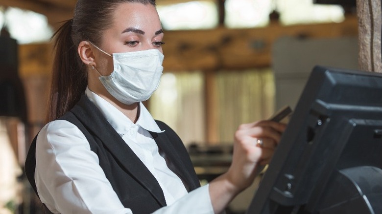 Cashier with mask