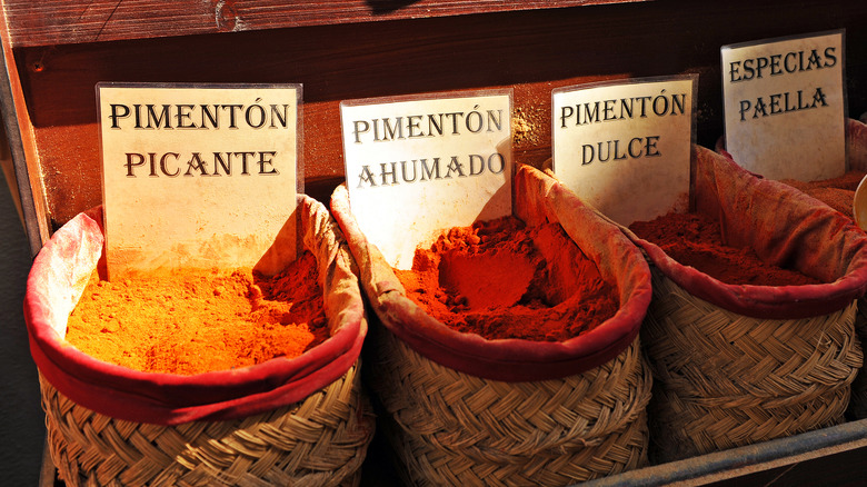 Different kinds of paprika for sale in baskets