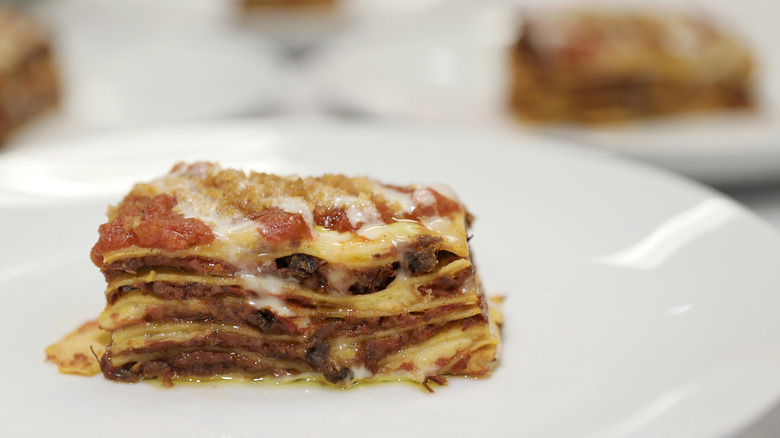 Baked lasagna slice on plate