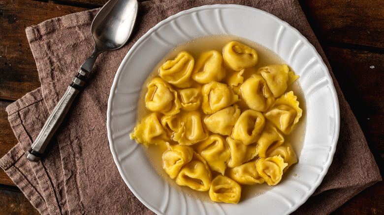 Tortellini in broth in bowl 