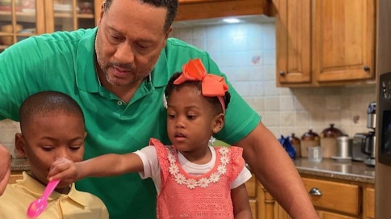 Pat Neely and children in kitchen