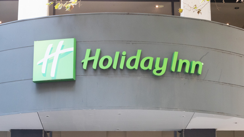 Holiday Inn sign green script