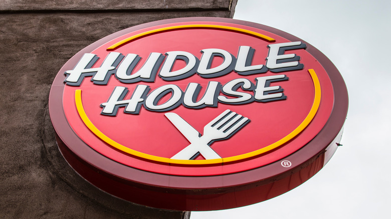 Huddle house sign, oval, red, white, and yellow