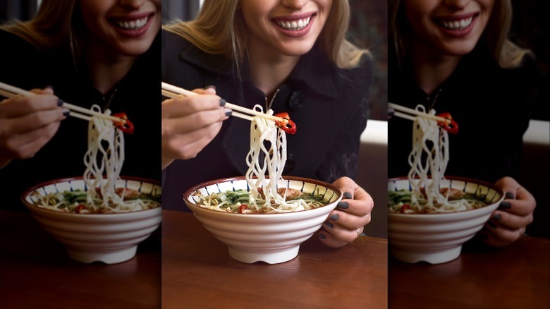 white woman eating pho