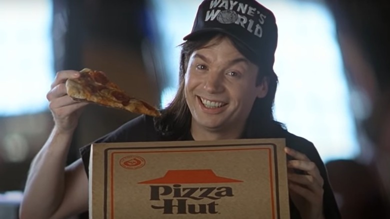 Mike Myers holding pizza in Wayne's World